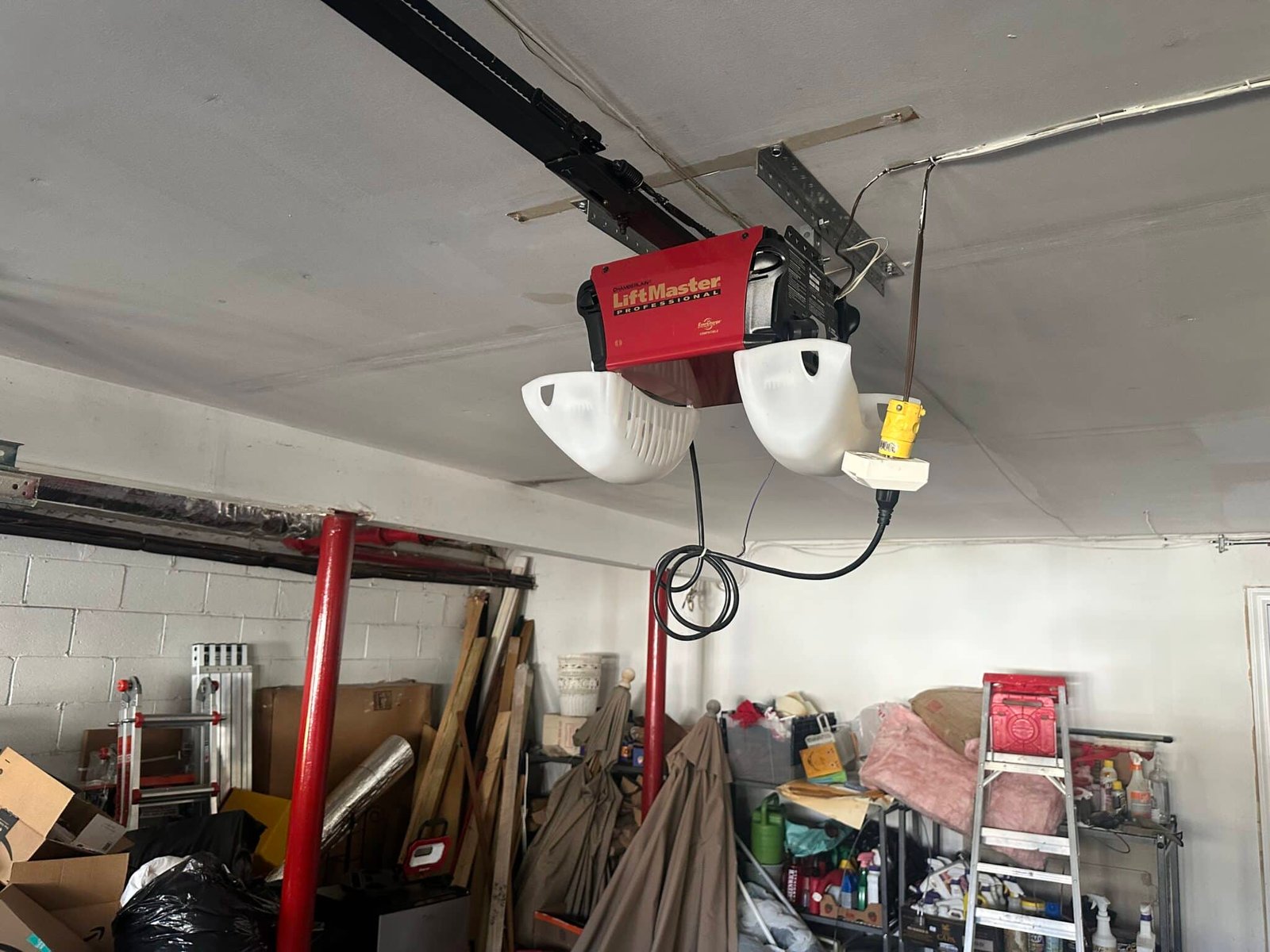 Old LiftMaster garage door opener before replacement in North Stamford CT